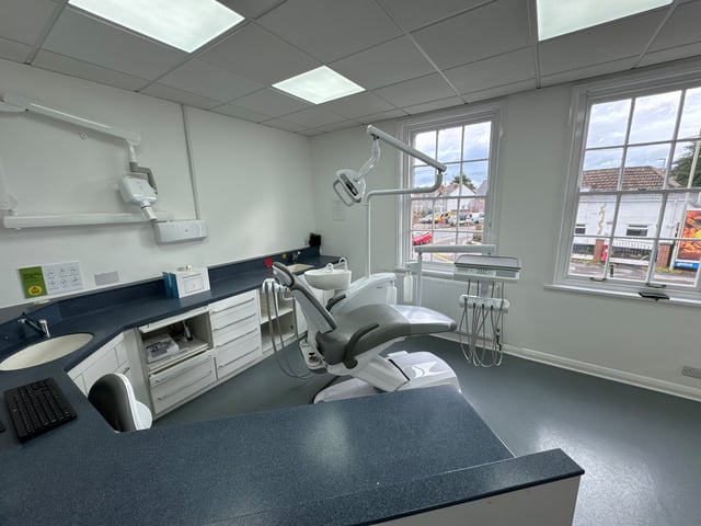 A GL1 Dental surgery room with wall artwork, Gloucester